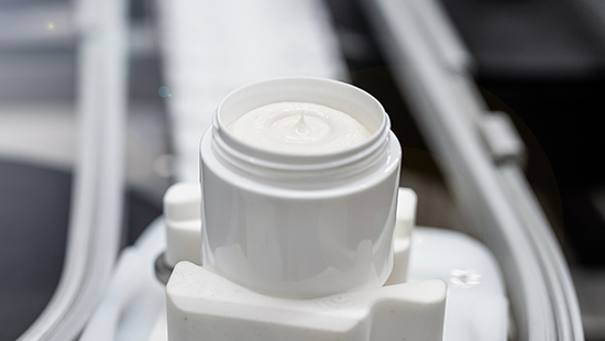 Jar of cosmetic cream in a personal care and cosmetics manufacturing plant