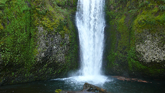 Clean water rushing from waterfall.