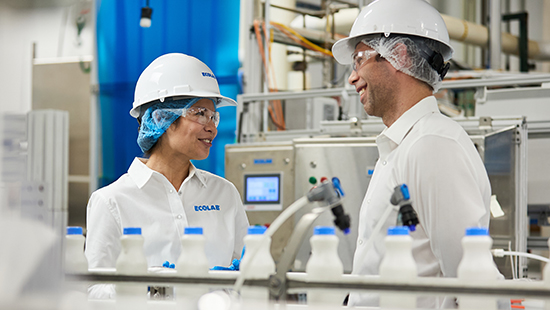 Ecolab experts in a dairy processing plant