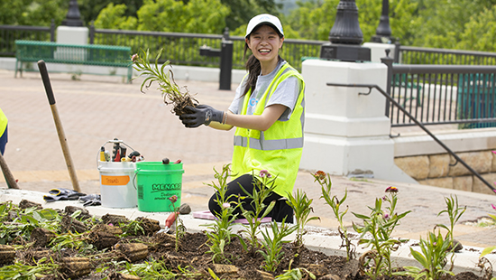 Ecolab associate planting plants