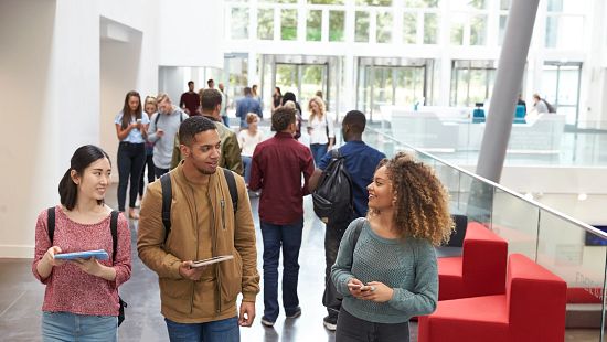 Older students in education building hallway