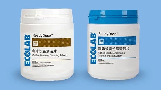 Two Ecolab ReadyDose containers for cleaning coffee machines, including one for general use and one specifically for milk systems.
