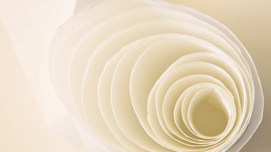 Happy woman holding white sheet.