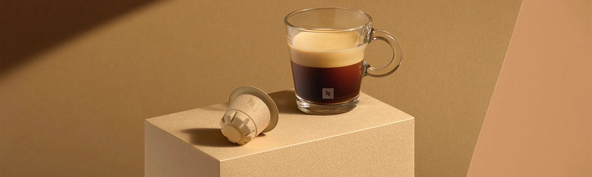 Nestle pod and a cup of coffee